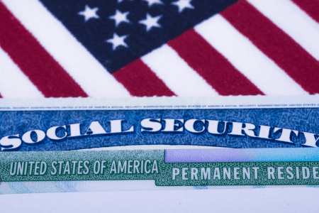 Social security card resting on American flag
