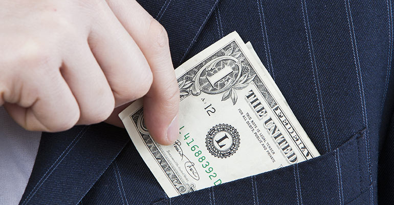 man pulling out one dollar bill from jacket front pocket