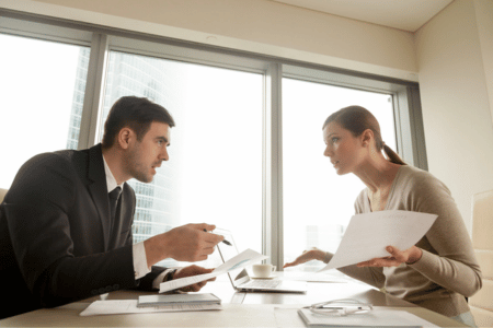 Lawyer and client reviewing wrongful termination paperwork