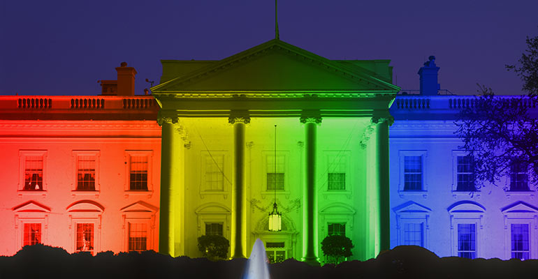 White House at night with rainbow lights for gay pride