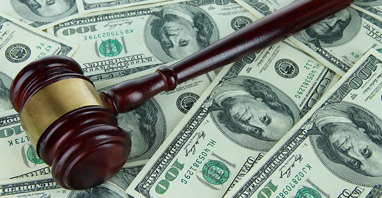 gavel sitting on money wage payment laws in florida