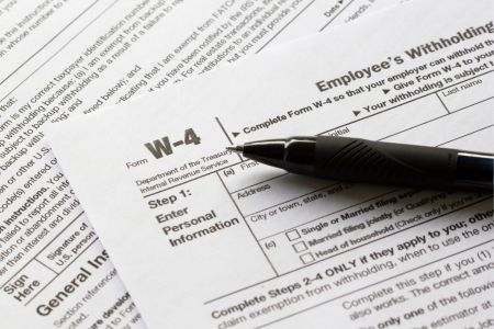 Pen resting on top of W-4 form