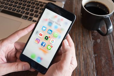 employee using social media on cellphone