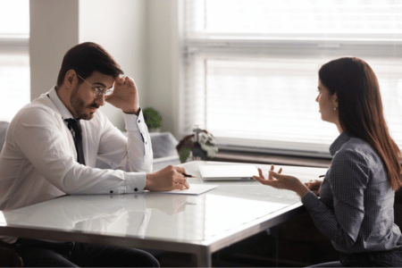 Employer looking at an employee who is requesting their check