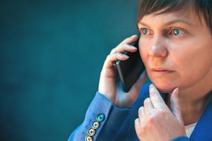 woman on the phone trying to find an employment law attorney