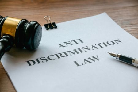 Gavel with anti-discrimination law document