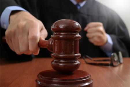 Judge ruling whether or not it is illegal to deny unpaid time off to an employee