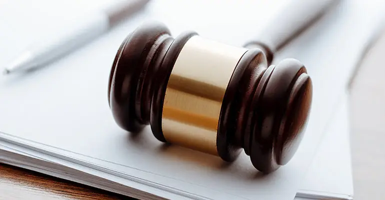 gavel atop blank paper