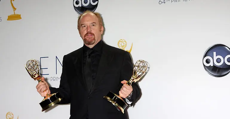 Louis C.K. holding awards