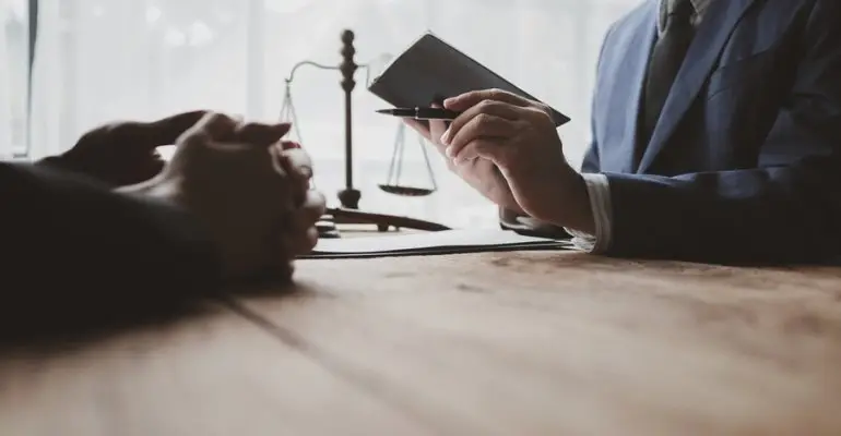 Lawyer and client discussing what makes a strong retaliation case