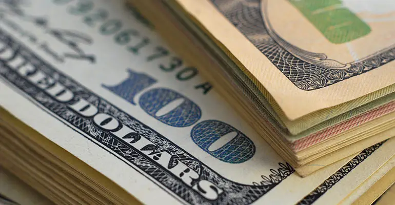 stack of one hundred dollar bills