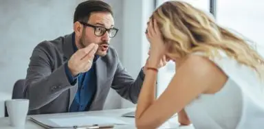 A man yelling at an employee