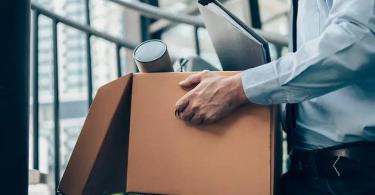 Employee collecting items after learning how long after FMLA you can be fired